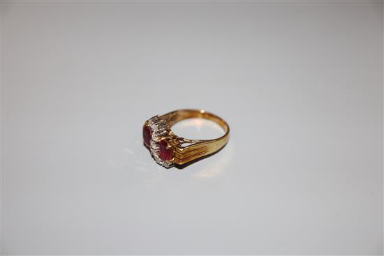 A 585 yellow metal ruby and diamond dress ring, size N, gross weight 5.4 grams.